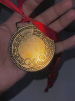 Blank Gold Medal with Red Ribbon, Embossed Olive Wreath Border - Image 3